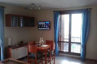 Una televisión o centro de entretenimiento en Apartamento Mayor
