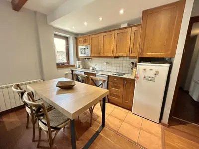 Una cocina o zona de cocina en Apartament rústic amb llar de foc by RURAL D'ÀNEU
