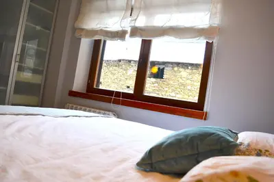 Cama o camas de una habitación en Apartament rústic amb llar de foc by RURAL D'ÀNEU