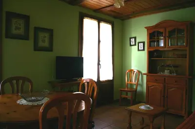 Una televisión o centro de entretenimiento en Apartamentos Casa Gallan