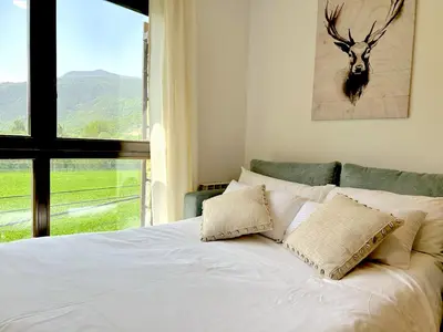 Cama o camas de una habitación en Apartament de disseny rústic amb vistes by RURAL D'ÀNEU