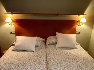 Cama o camas de una habitación en Casa Lauré II - PANTICOSA