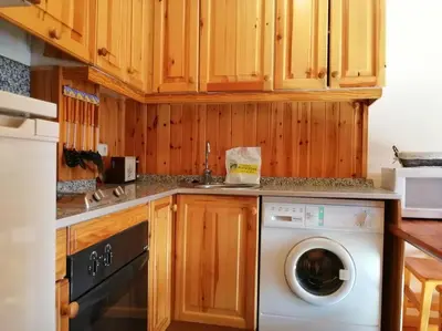 Una cocina o zona de cocina en Ambiente cálido y acogedor -Rincón rústico - Falcó 17
