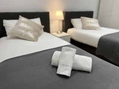 Cama o camas de una habitación en Apartamenticos Plaza Las Armas III