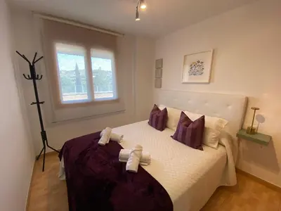 Cama o camas de una habitación en Apartamentos Alcañiz, Santa María, 3