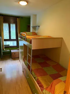 Cama o camas de una habitación en BIESCAS Todas las comodidades y más GAS, GARAJE , TRASTERO, CENTRO, WIFI,