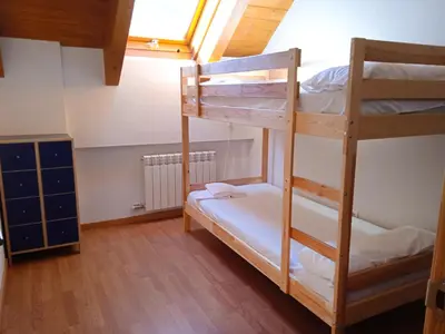 Cama o camas de una habitación en Apartamentos Villanua Collarada 3000