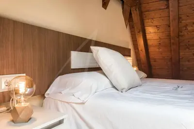 Cama o camas de una habitación en Casa Artiga de Lin by SeaMount Rentals
