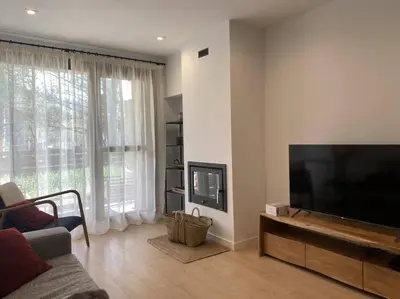 Una televisión o centro de entretenimiento en Apartamento ideal en el corazón de los Pirineos