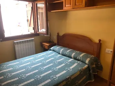 Cama o camas de una habitación en apartamentos casa botero