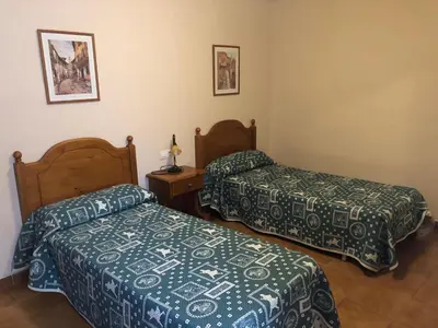 Cama o camas de una habitación en apartamentos casa botero