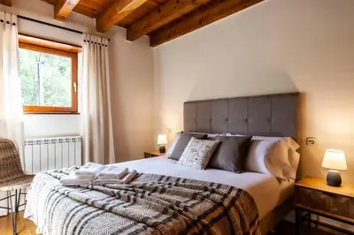 Cama o camas de una habitación en Espacioso Apartamento con Jardín en Salardú