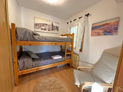 Cama o camas de una habitación en Apartamentos Confort Formigal 3000