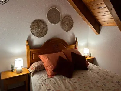 Cama o camas de una habitación en El rincón de Benás