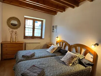 Cama o camas de una habitación en El rincón de Benás
