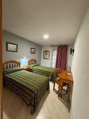 Cama o camas de una habitación en Hostal Marboré
