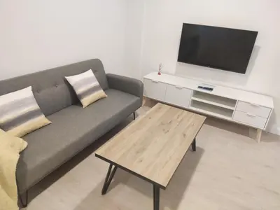 Una televisión o centro de entretenimiento en Txoko Loft Moncayo