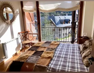 Cama o camas de una habitación en Elegante apartamento en Escarrilla con vistas al valle