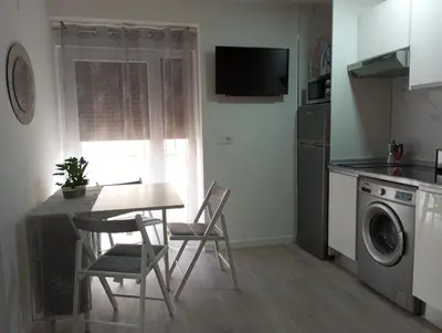 Una cocina o zona de cocina en Apartamentos 