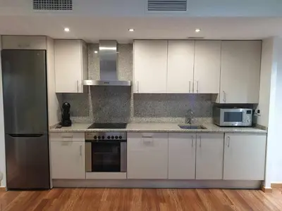 Una cocina o zona de cocina en Centro aparcamiento gratuito al lado del pilar