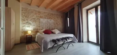 Cama o camas de una habitación en APARTAMENTS LA DONZELLA