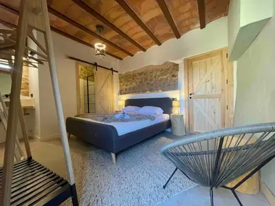 Cama o camas de una habitación en Castell de l'Aguda
