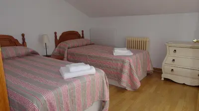Cama o camas de una habitación en Chalet junto a la Ciudadela de Jaca