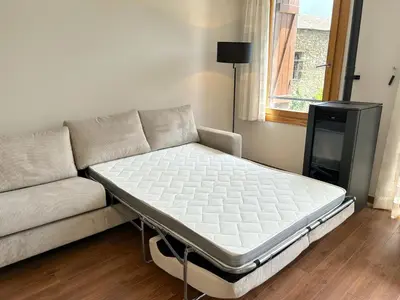 Una televisión o centro de entretenimiento en Apartament al centre d'Esterri amb vistes úniques by RURAL D'ÀNEU