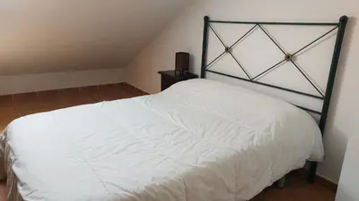 Cama o camas de una habitación en Apartamentos Castiello de Jaca 3000