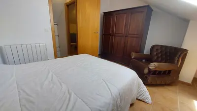 Cama o camas de una habitación en Apartamentos Castiello de Jaca 3000