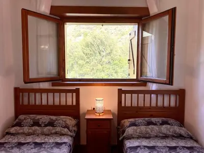Cama o camas de una habitación en Apartament Els Raiers - L'Amfitriona