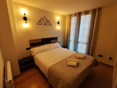 Cama o camas de una habitación en Dúplex en Valencia d'Àneu (Baqueira Beret)
