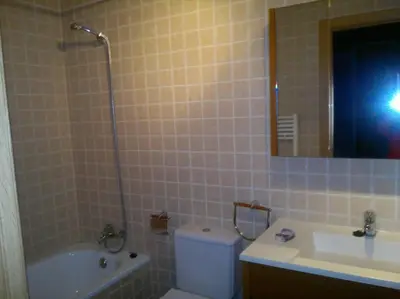 Un baño de Acogedora Morada de Montaña
