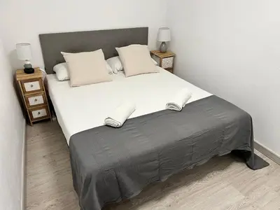 Cama o camas de una habitación en Apartamenticos La Paz I