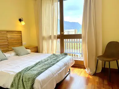 Cama o camas de una habitación en Apartament d'estil pirineic amb vistes úniques by RURAL D'ÀNEU