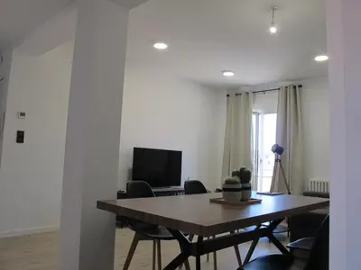 Una televisión o centro de entretenimiento en Apartamento grande en Huesca