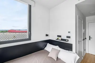 Cama o camas de una habitación en Home and CoLiving Pamplona