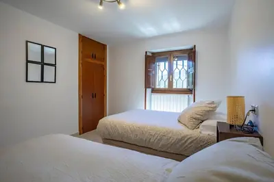 Cama o camas de una habitación en Casa Feli - APARTAMENTO con JARDÍN PRIVADO en los PIRINEOS