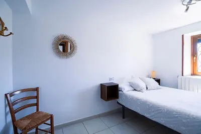 Cama o camas de una habitación en Casa Feli - APARTAMENTO con JARDÍN PRIVADO en los PIRINEOS