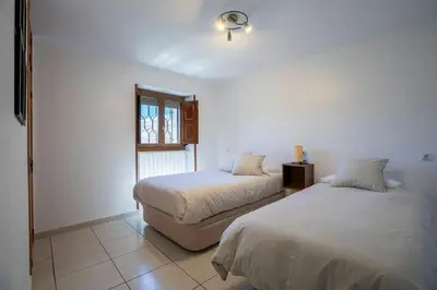 Cama o camas de una habitación en Casa Feli - APARTAMENTO con JARDÍN PRIVADO en los PIRINEOS