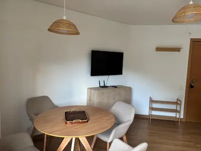 Una televisión o centro de entretenimiento en TUCA - Apartamento en Vielha