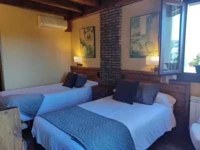 Cama o camas de una habitación en Hotel Rural Irati selva de Irati