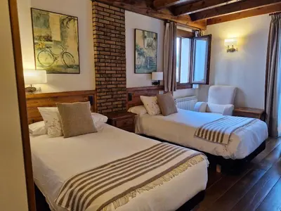 Cama o camas de una habitación en Hotel Rural Irati selva de Irati