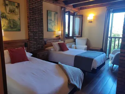 Cama o camas de una habitación en Hotel Rural Irati selva de Irati