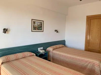 Cama o camas de una habitación en Hotel Pepa