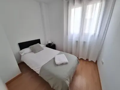 Cama o camas de una habitación en Los Pinos, acogedor apartamento con garaje - Arafita Apartamentos