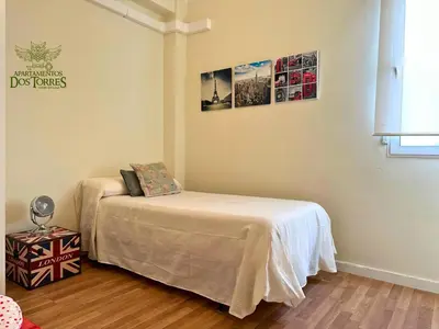 Cama o camas de una habitación en Dos Torres Valinor - Plaza del Pilar