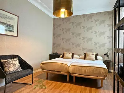 Cama o camas de una habitación en Dos Torres Valinor - Plaza del Pilar