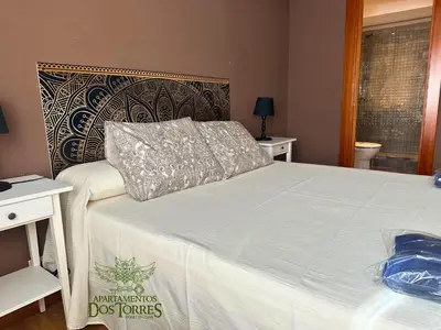 Cama o camas de una habitación en Dos Torres Ático - Solárium Privado en Calle Alfonso I
