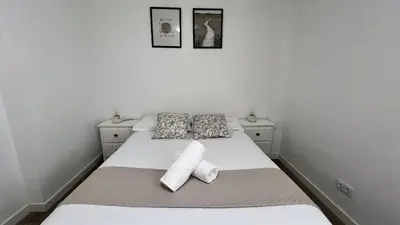Cama o camas de una habitación en Apartamenticos Plaza del Pilar III